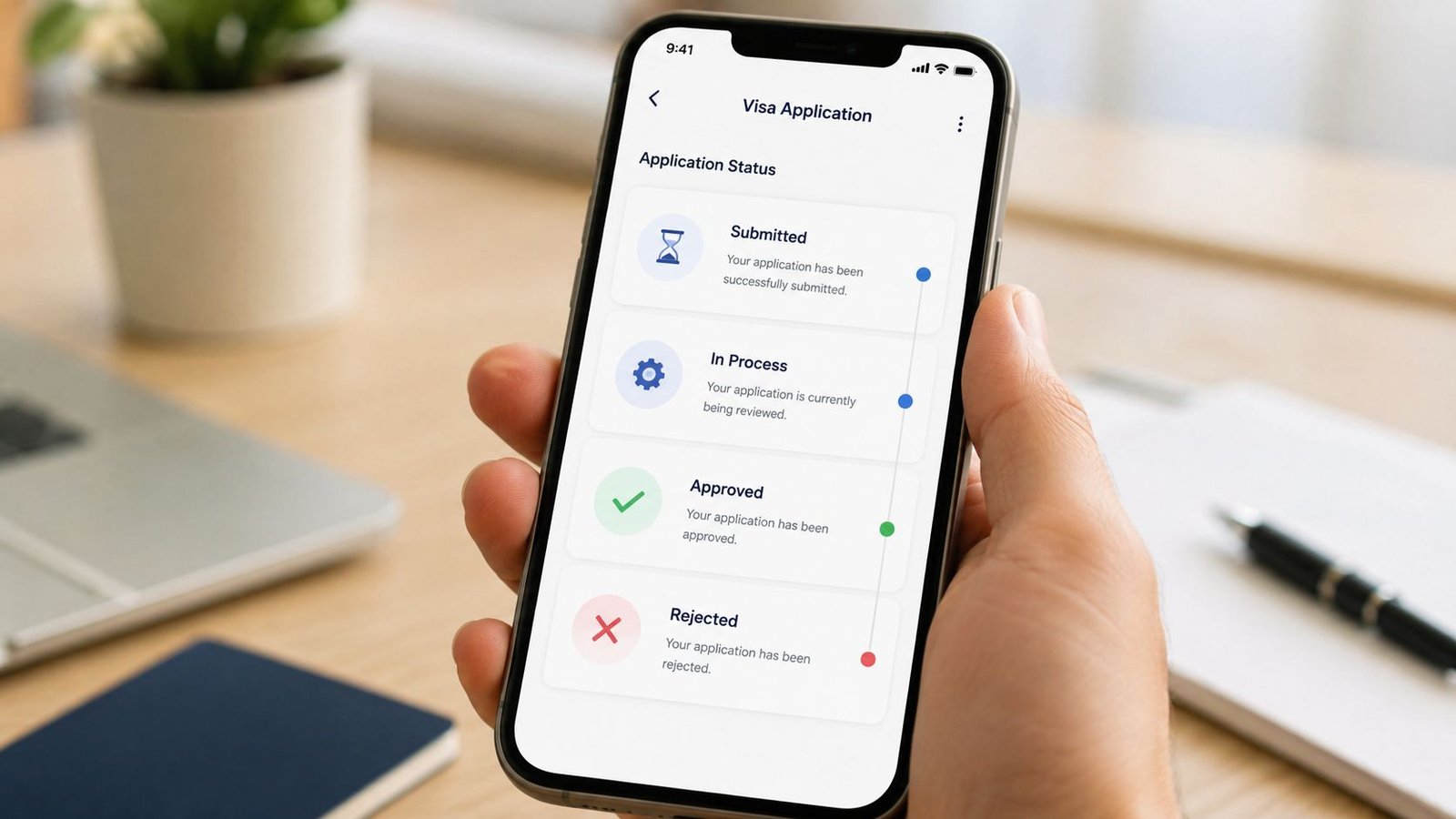 A smartphone held in hand displaying a visa application status tracking interface on the mobile screen.